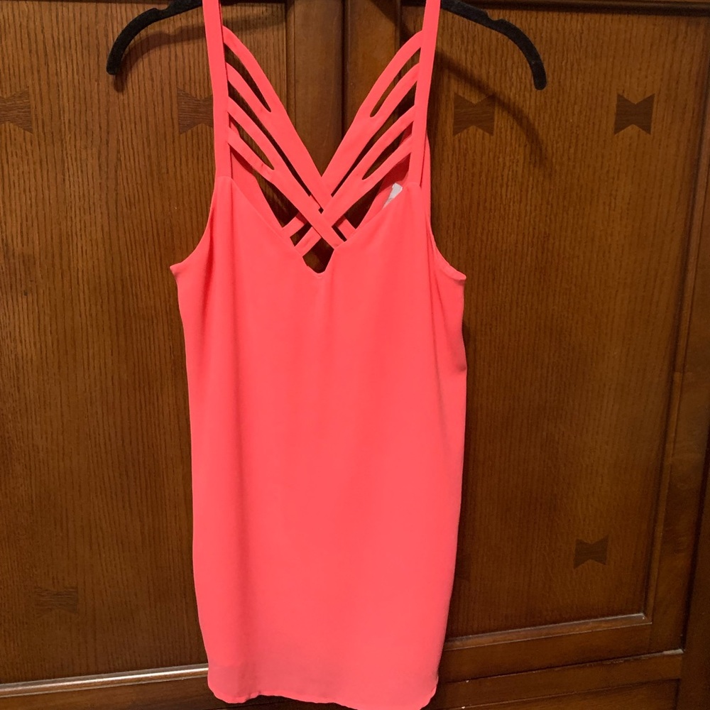 Float like a dreamsicle in the dog days of summer, in this delicate, floaty, top